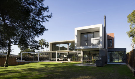 Casas Houzz: Una vivienda nacida de la mezcla de volúmenes contundentes