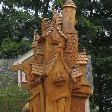 A custom sculpture formed out of the trunk of a belove tree lost during a storm.