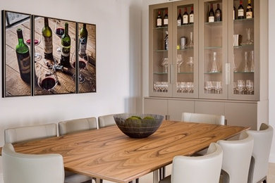 Mid-sized contemporary dining room in Miami with beige walls and travertine floors.
