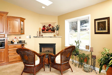 Example of a mid-sized classic l-shaped medium tone wood floor eat-in kitchen design in Baltimore with an undermount sink, recessed-panel cabinets, medium tone wood cabinets, granite countertops, stainless steel appliances and an island