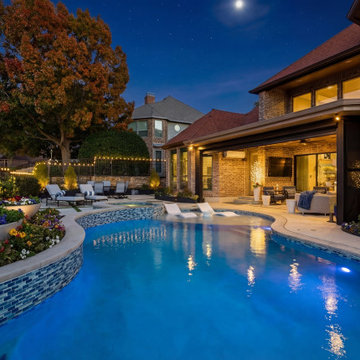 Custom Outdoor Living Pool Deck with Stamped Concrete & Turf