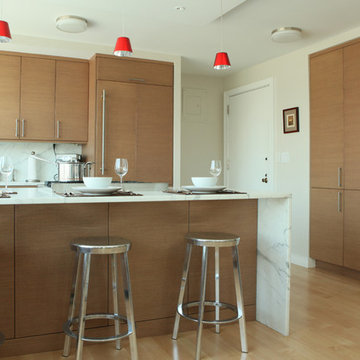 Rift Cut Cabinetry with Waterfall Countertop in Contemporary Manhattan Apartment