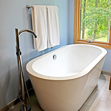 Master Bathroom with Free Standing Tub, Quartz Countertop and Grey Tiled Shower