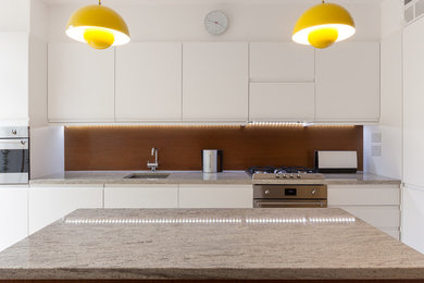 This is an example of a midcentury kitchen in Surrey.