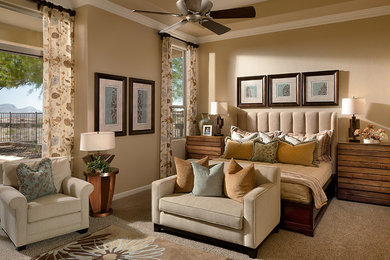 Photo of a large transitional master bedroom in Phoenix with beige walls, carpet, no fireplace and beige floor.