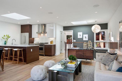 Inspiration for a contemporary open concept light wood floor living room remodel in Los Angeles with gray walls, no fireplace and no tv
