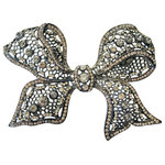 Evelyn Hope Collection - Lace Crystal Decorating Pin, Silverbow - Includes one silver bow. Home decorating will never be the same. Introducing our newest decorating-lifestyle pin. A little bit lacey, a little bit edgy with vibrant crystals in smoke silver or warm gold. These are not standard brooches, they have a unique back that enables them to be used on soft and firm surfaces easily. Display them on pillows, wreaths, place settings, gifts, frames, baskets, lamp shades, draperies, bridal bouquets, wood signs and more. Specially designed with a straight backand smooth closure, the pin will add a dash of magic that stays securely.This richly colored statement pin is silver with clear, vibrant silver crystals. 4 inches wide by 3.5 tall.  We have shown you some decorating ideas but you can get creative with them and even wear them out on the town! Order is for one decorating pin. Pin also sold on our pillows in our Houzz Shop. Custom designed by Evelyn Hope Collection. Choice of gold, silver or a set of two.