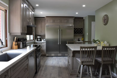 Example of a transitional kitchen design in Toronto
