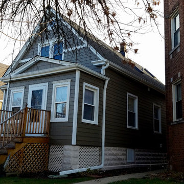 Chicago, IL Bungalow Siding Replacement with Dark Brown Siding
