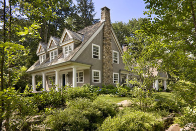 Huge beige two-story wood exterior home idea in New York