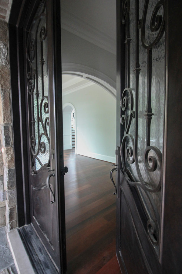 Powerful Impression by Floating Staircase in Suburban Foyer