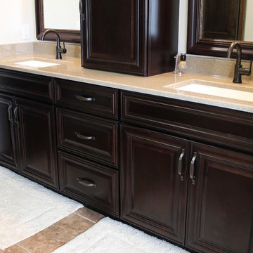 Farmhouse kitchen Taupe Painted Cabinets,Quartz Tops, and Dark Island