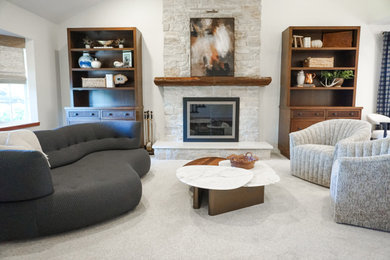 Transitional carpeted living room photo in Orange County with a stone fireplace