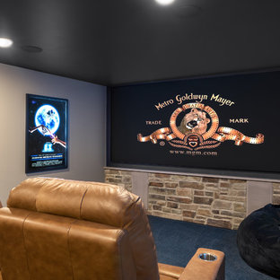 Inspiration for a large traditional enclosed home cinema in St Louis with grey walls, carpet, a projector screen and blue floors.