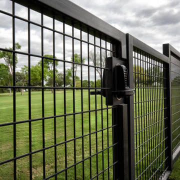 Custom Metal Fence & Electric Driveway Gate with Stone Accents