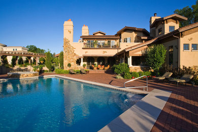 Design ideas for a mediterranean backyard brick landscaping in Chicago.