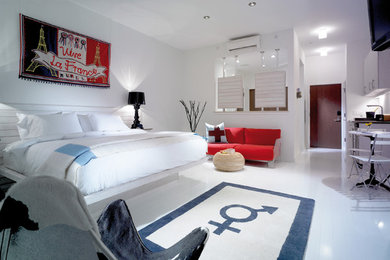 Bedroom - large contemporary loft-style painted wood floor bedroom idea in Philadelphia with white walls