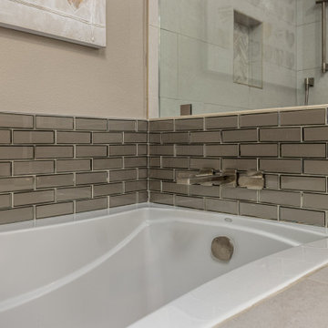 Built-in Kohler Bathtub with Beveled Subway tile in Bathroom Remodel