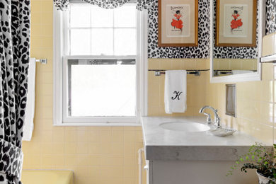 Small eclectic master yellow tile and ceramic tile yellow floor, single-sink and wallpaper bathroom photo in Minneapolis with flat-panel cabinets, white cabinets, a two-piece toilet, an undermount sink, marble countertops, white countertops and a built-in vanity