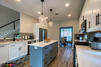 Example of a large trendy galley porcelain tile and brown floor eat-in kitchen design in Austin with an undermount sink, shaker cabinets, white cabinets, quartz countertops, beige backsplash, porcelain backsplash, stainless steel appliances, an island and white countertops
