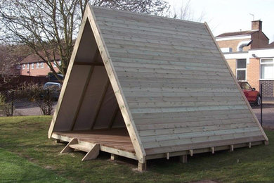 This is an example of a small contemporary detached garden shed and building.