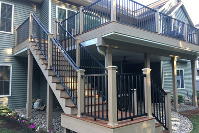 Deck - mid-sized craftsman backyard deck idea in Grand Rapids with no cover