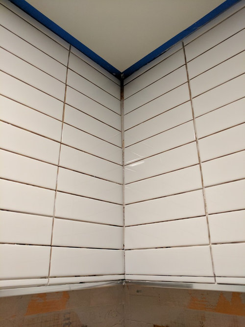 Corner grout line widining as approaches ceiling. Advice Needed!