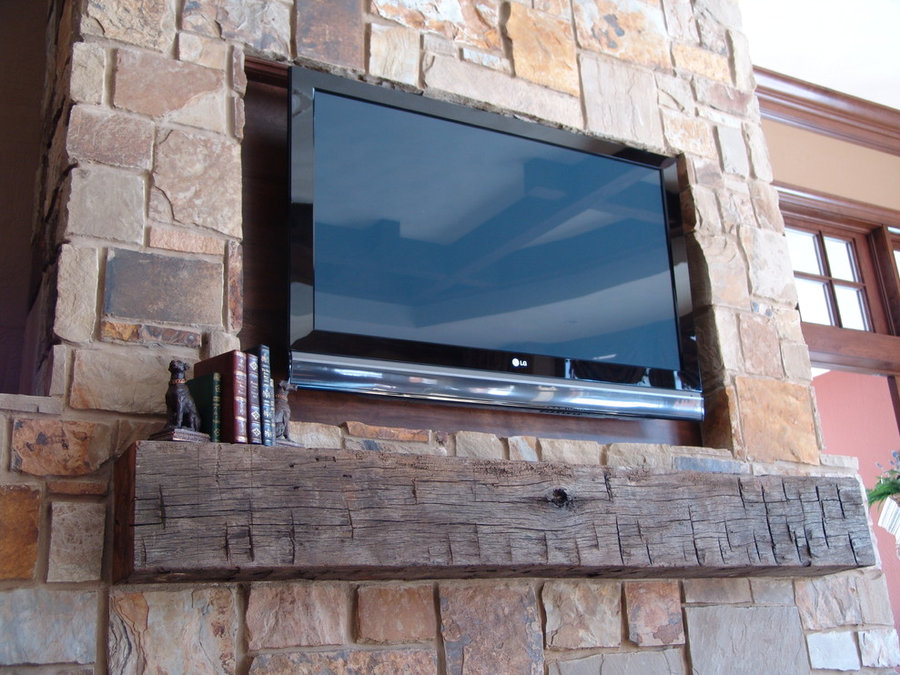 Rustic Mantle in Stone Fireplace with Recessed Area for TV