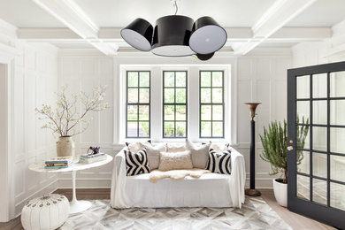 Foyer - transitional light wood floor and beige floor foyer idea in New York with white walls