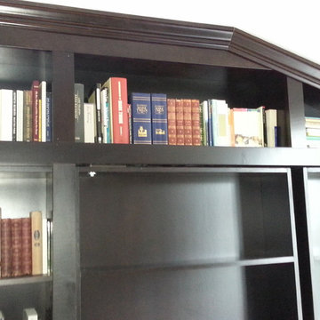 Built-in Bookcases with Rolling Ladder and Hidden Vault