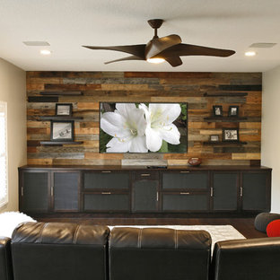 Inspiration for a large contemporary open concept dark wood floor and brown floor home theater remodel in Tampa with beige walls and a wall-mounted tv