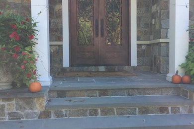 Example of a mid-sized classic stone exterior home design in New York