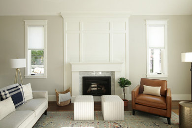 Example of a large transitional enclosed dark wood floor, brown floor and wainscoting living room design in Salt Lake City with white walls, a standard fireplace and a brick fireplace