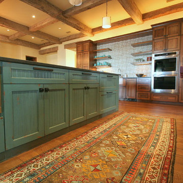 Ranch house kitchen with stained cabinets and glazed island