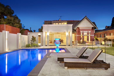 Photo of a contemporary l-shaped pool in Melbourne.