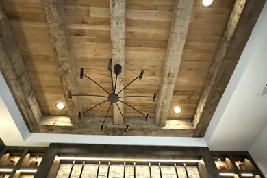 Example of a farmhouse wine cellar design in Charlotte
