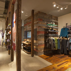 Antique Red Barnwood Paneling and Reclaimed Wood Flooring in a Modern Retail Store - Wall Panels