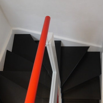 Glass staircase with red stainless steel handle