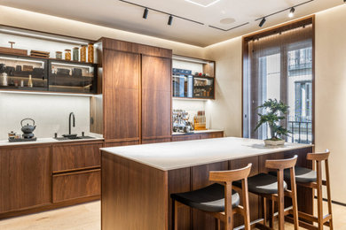 Eat-in kitchen - small contemporary single-wall light wood floor and beige floor eat-in kitchen idea in Los Angeles with an undermount sink, recessed-panel cabinets, dark wood cabinets, quartz countertops, white backsplash, porcelain backsplash, paneled appliances, an island and white countertops