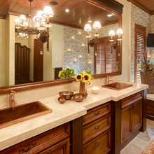 stone wall next to bathtub