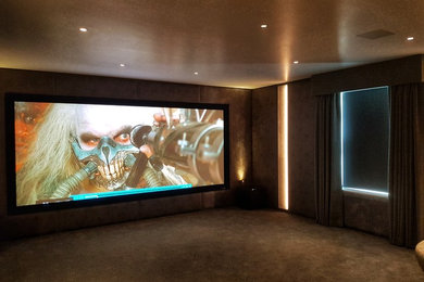 Photo of a contemporary home cinema in Gloucestershire.