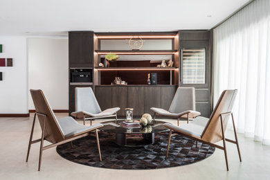 Inspiration for a contemporary open concept gray floor living room remodel in Miami with a bar and white walls