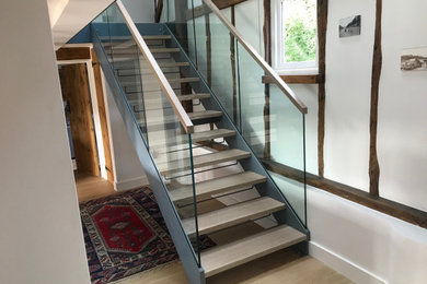This is an example of a rustic staircase in Surrey.