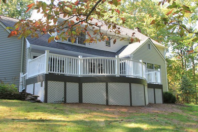 Inspiration for a large transitional backyard deck remodel in New York