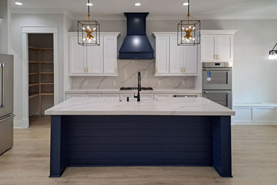 Example of a minimalist kitchen design with shaker cabinets