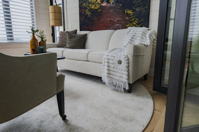 Inspiration for a modern porcelain tile and brown floor sunroom remodel in Other
