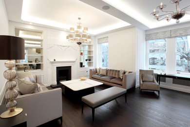 Design ideas for a medium sized contemporary open plan living room in London with beige walls, dark hardwood flooring, a two-sided fireplace, a stone fireplace surround, brown floors and panelled walls.
