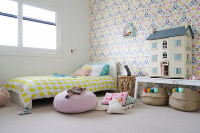 Design ideas for a transitional kids' bedroom for kids 4-10 years old and girls in Melbourne with multi-coloured walls and carpet.