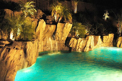 Inspiration for a mid-sized coastal backyard custom-shaped natural pool fountain remodel in Orange County