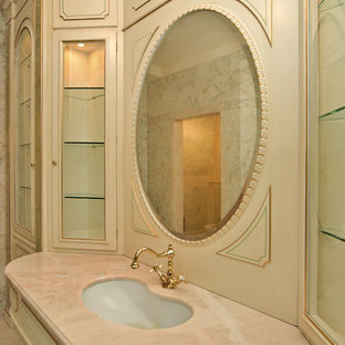 Inspiration for a huge timeless master beige tile and marble tile marble floor and pink floor bathroom remodel in Moscow with raised-panel cabinets, beige cabinets, pink walls, an undermount sink, onyx countertops and pink countertops